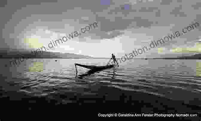 A Solitary Fisherman In A Small Boat Amidst A Tranquil Ocean, Representing The Intimate Connection Between Humans And The Marine Environment. Blue Ecocriticism And The Oceanic Imperative (Routledge Environmental Humanities)