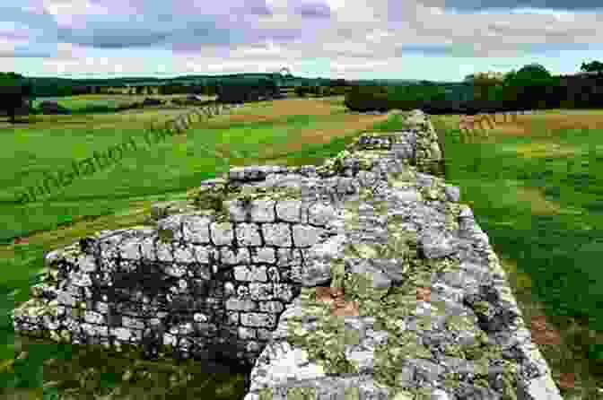 A Visitor Exploring The Ruins Of Birdoswald Roman Fort, Surrounded By Stone Walls And Ancient Artifacts Hadrian S Cycleway Coast 2 Coast